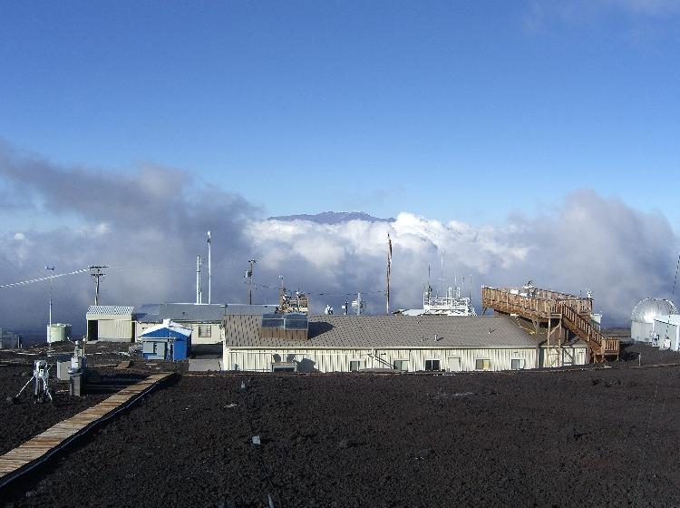 Clouds rise up toward the Mauna Loa Observatory.